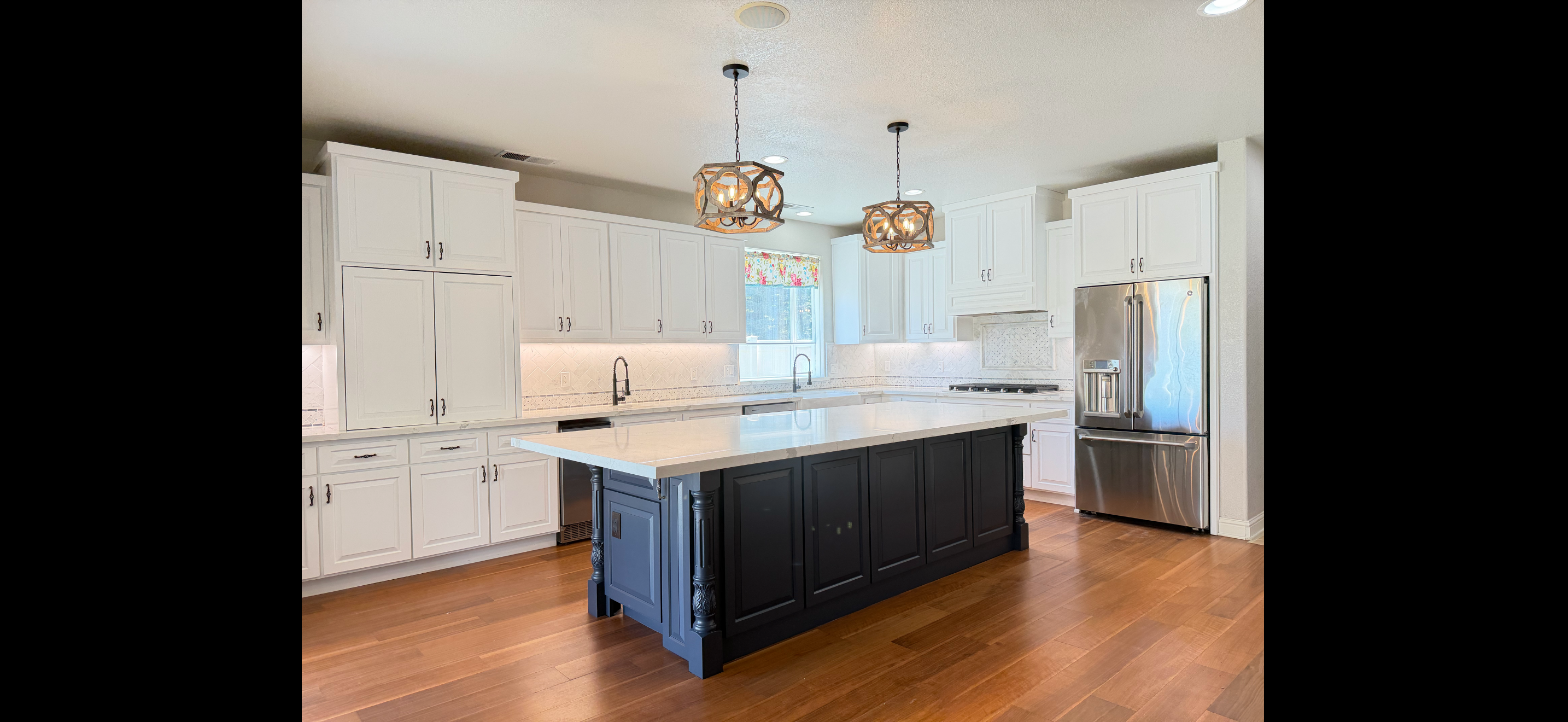 Modern kitchen white cabinets black island — HCIC