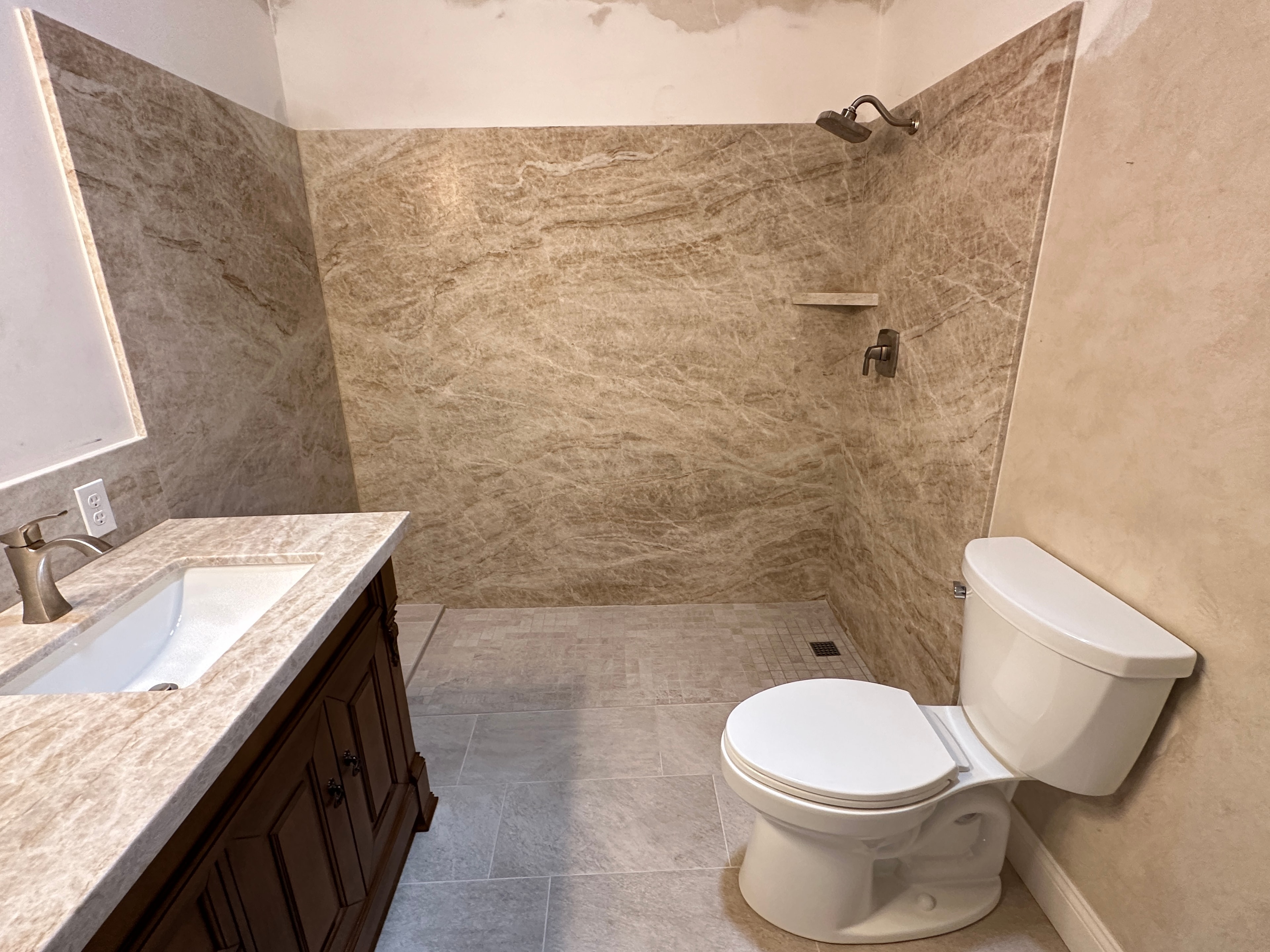 Modern bathroom with marble tile shower — HCIC