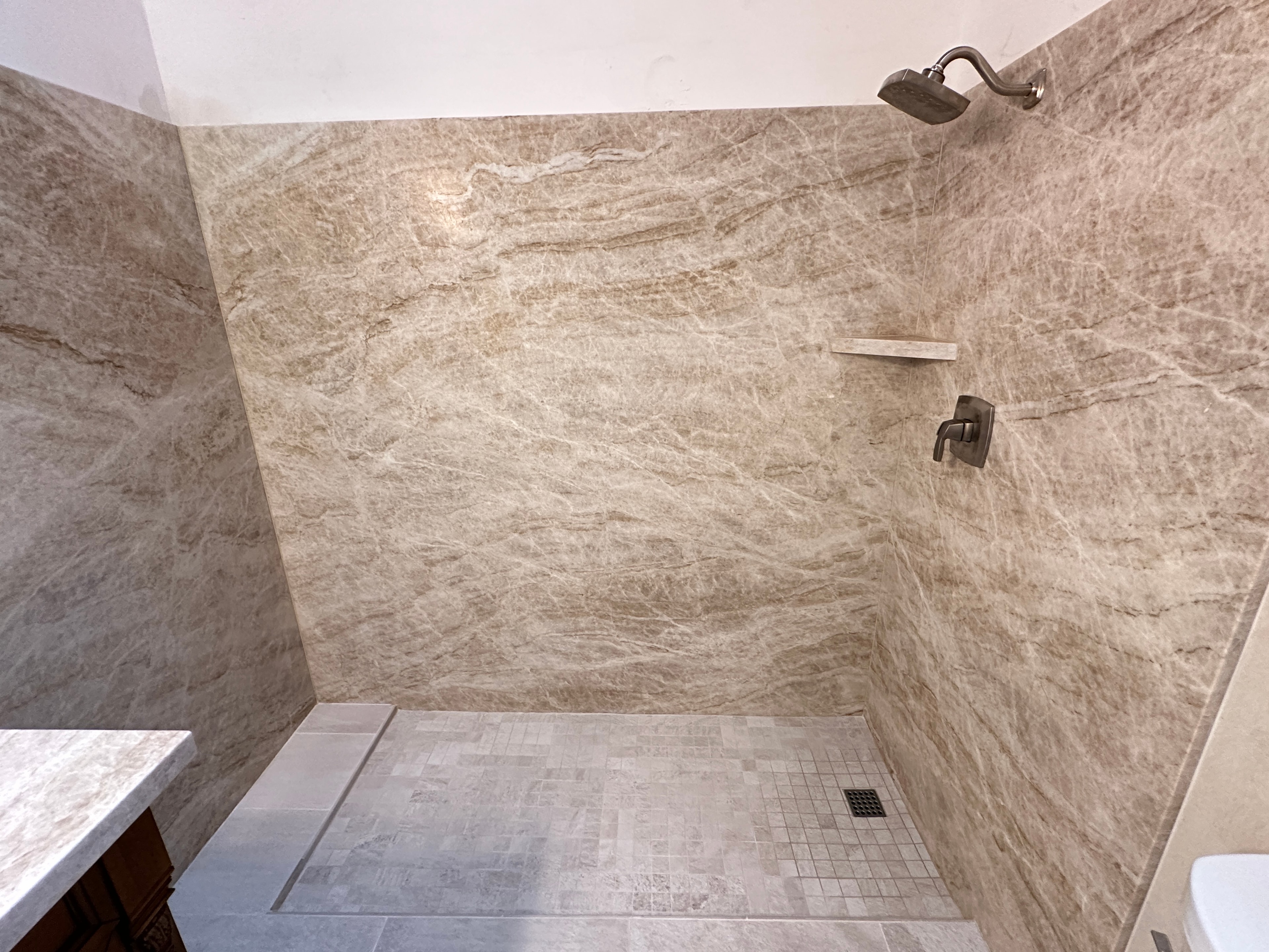 Modern bathroom shower with travertine tile — HCIC