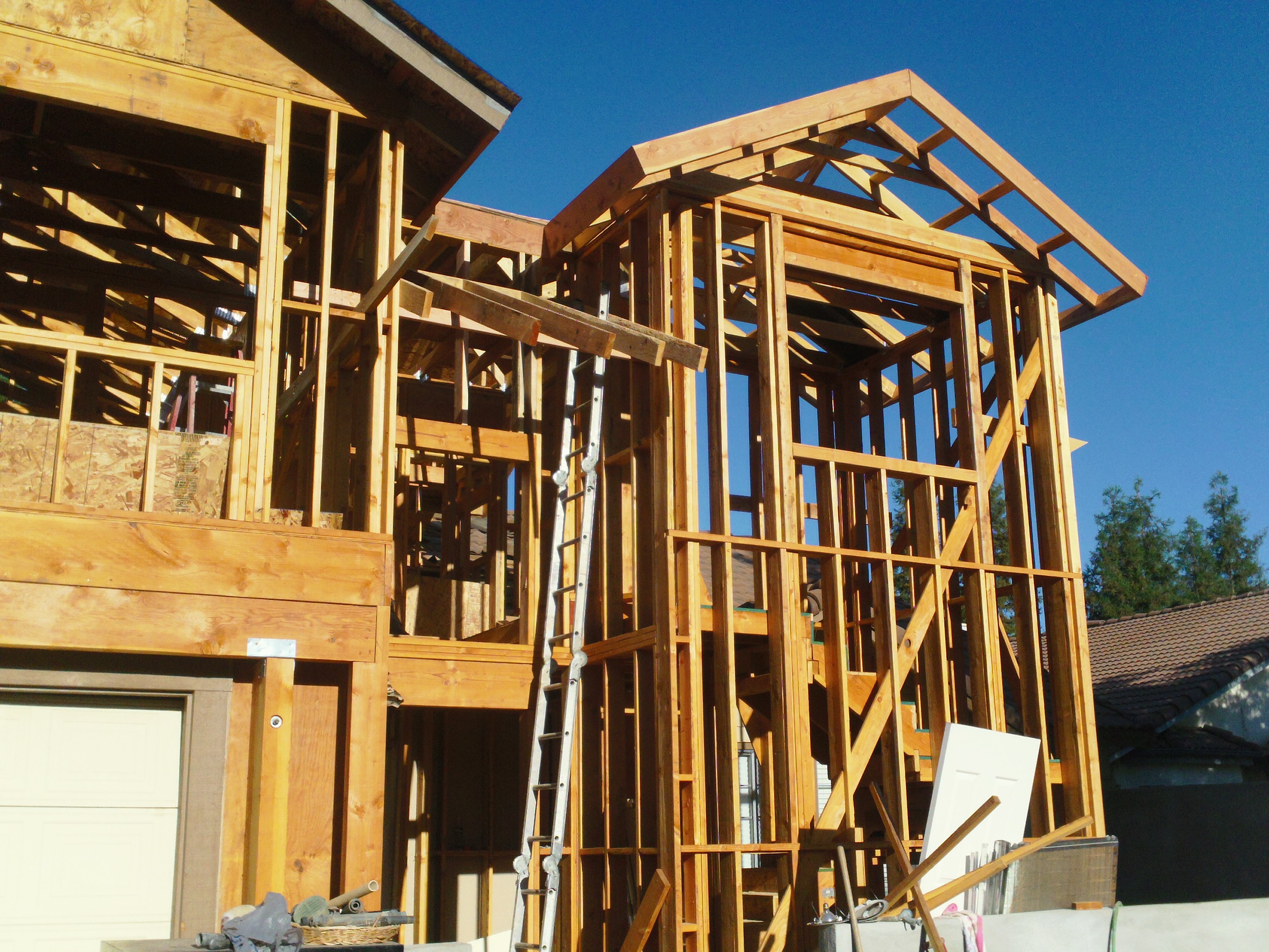 Wooden house frame under construction — HCIC