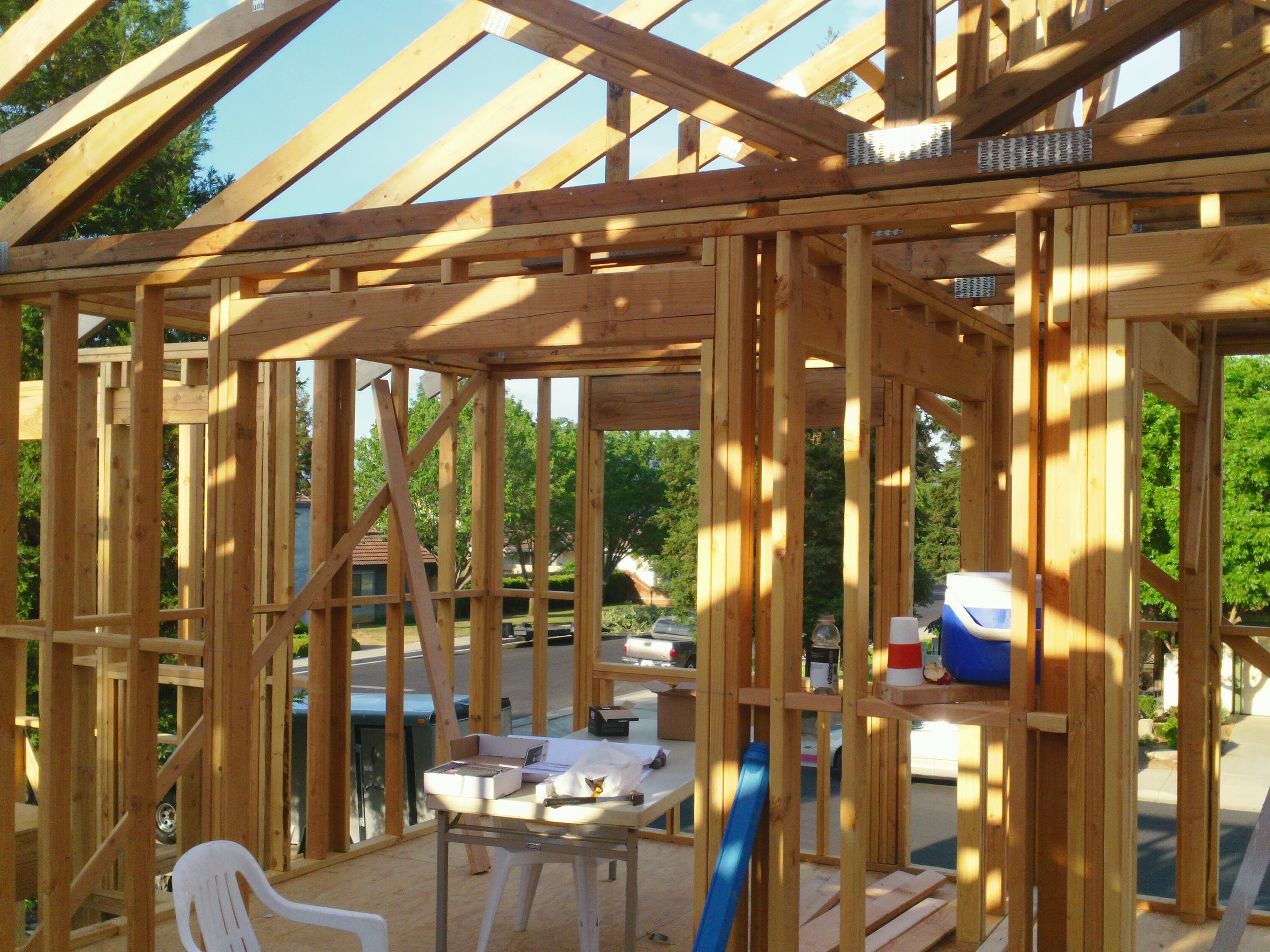 Wooden house frame under construction — HCIC