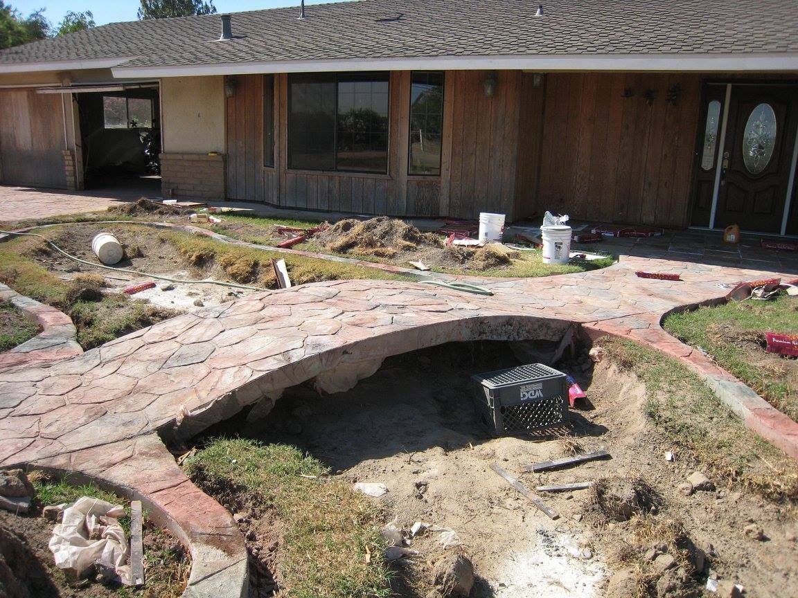 Backyard pond construction in progress — HCIC