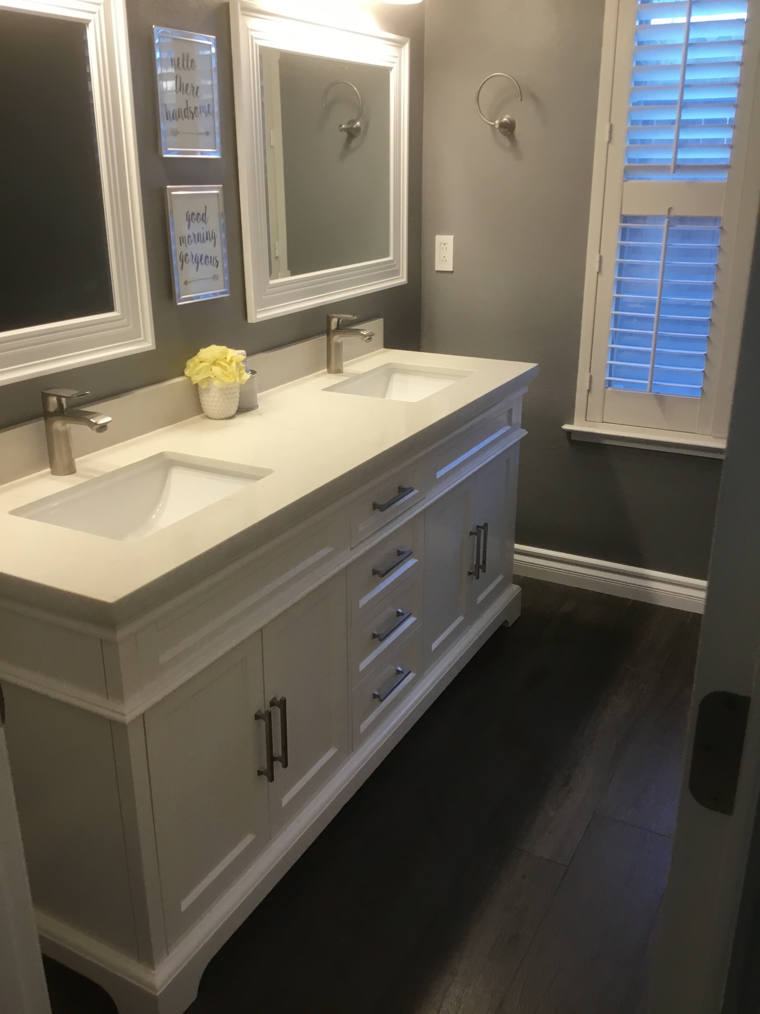 Modern bathroom double vanity white countertop — HCIC