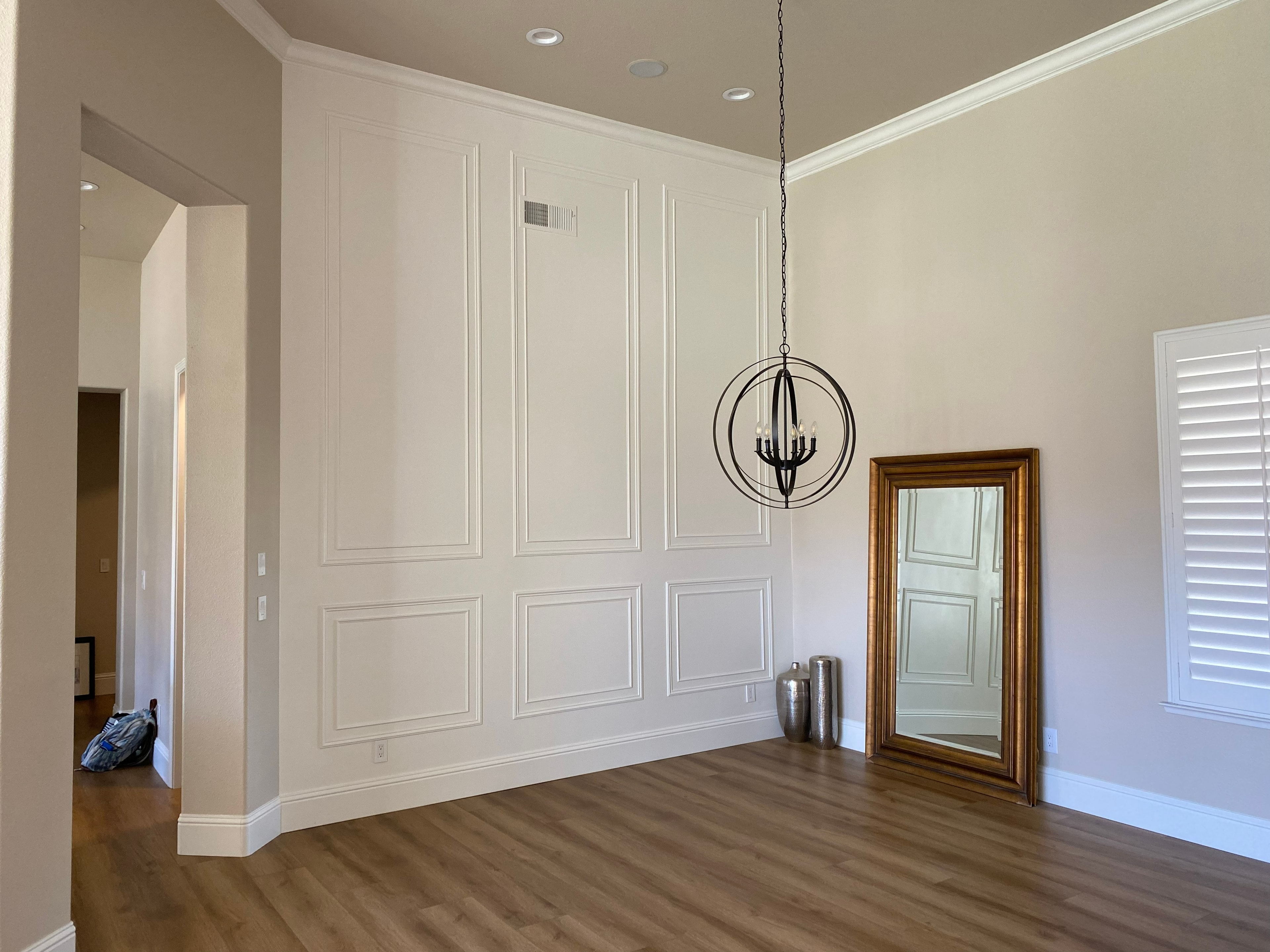 Modern living room with pendant light fixture — HCIC
