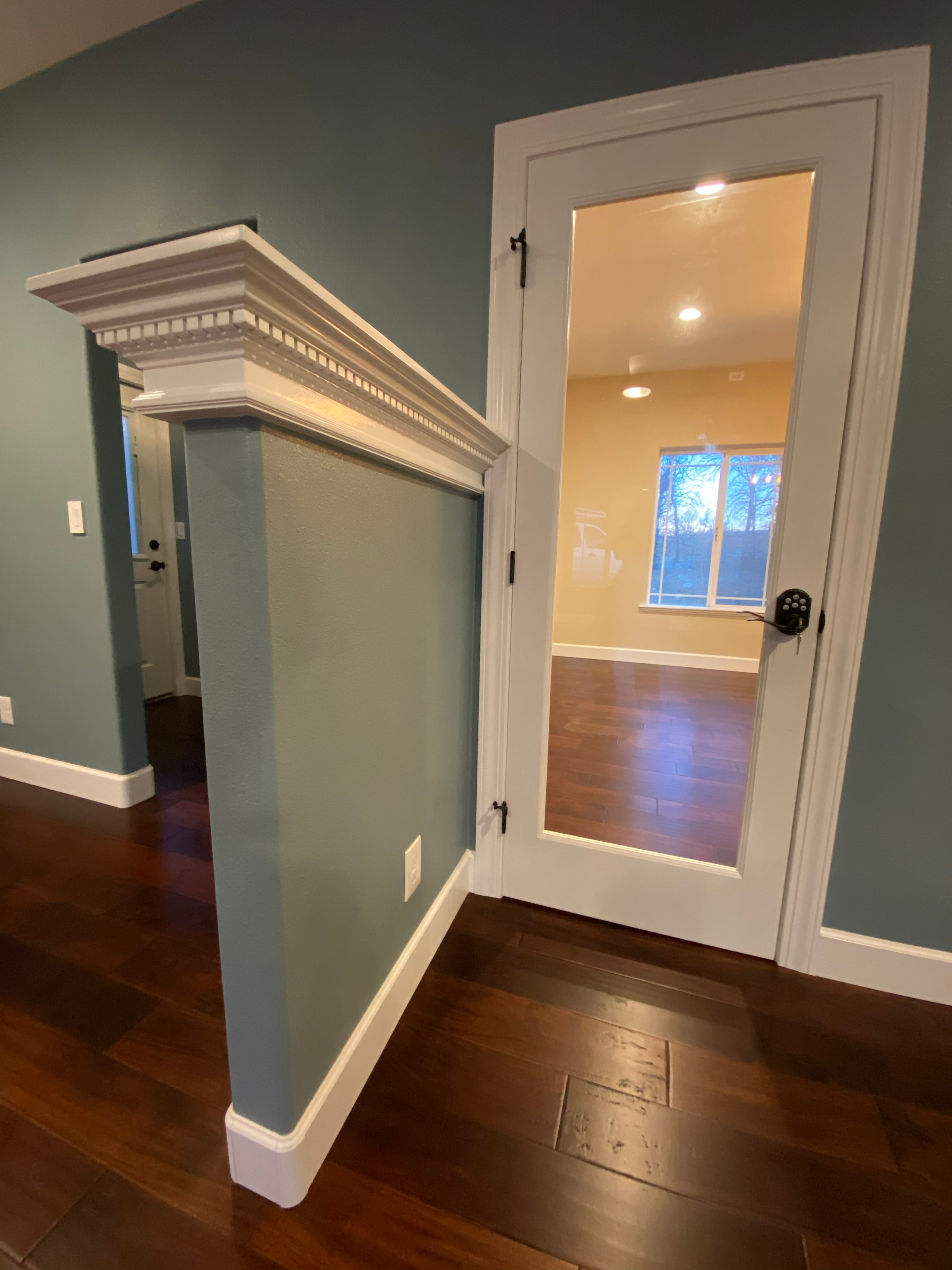 Modern home interior with glass door entry — HCIC
