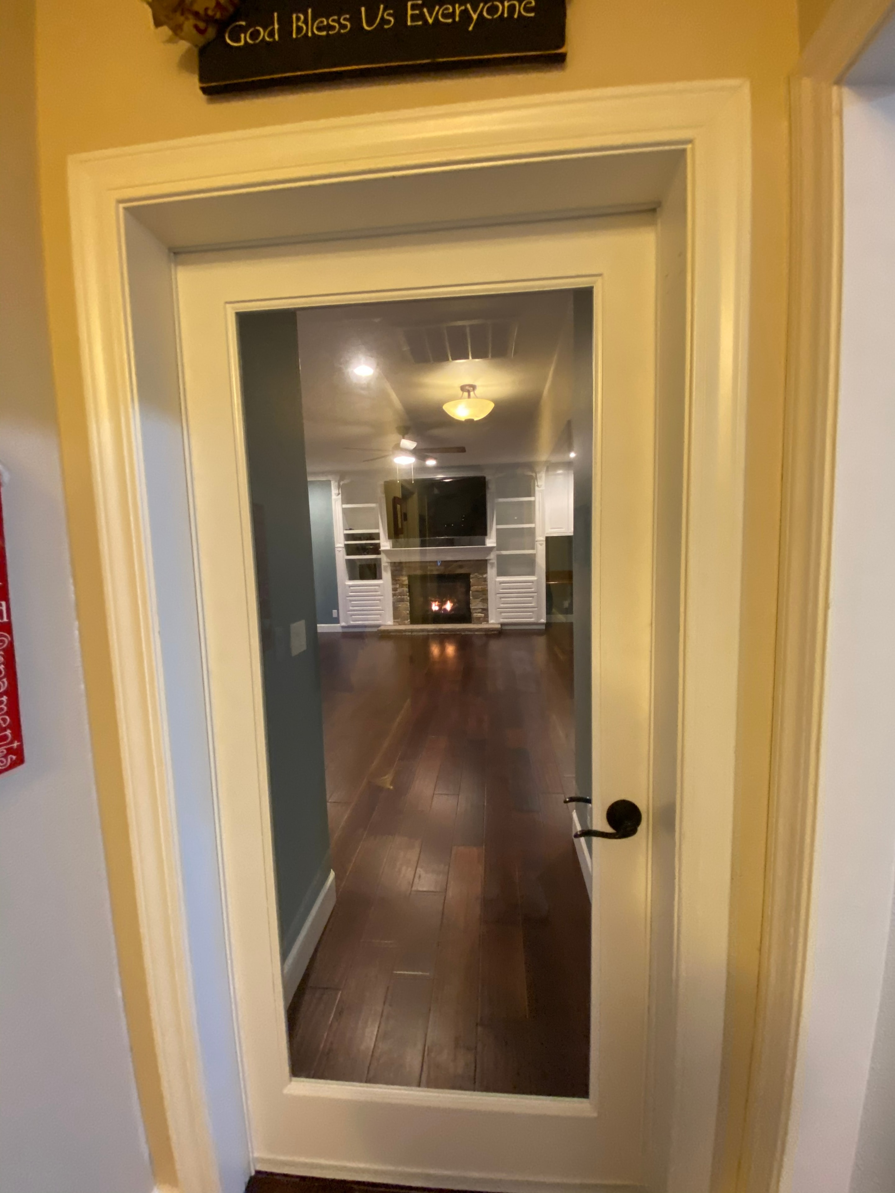 Doorway view living room fireplace entertainment — HCIC