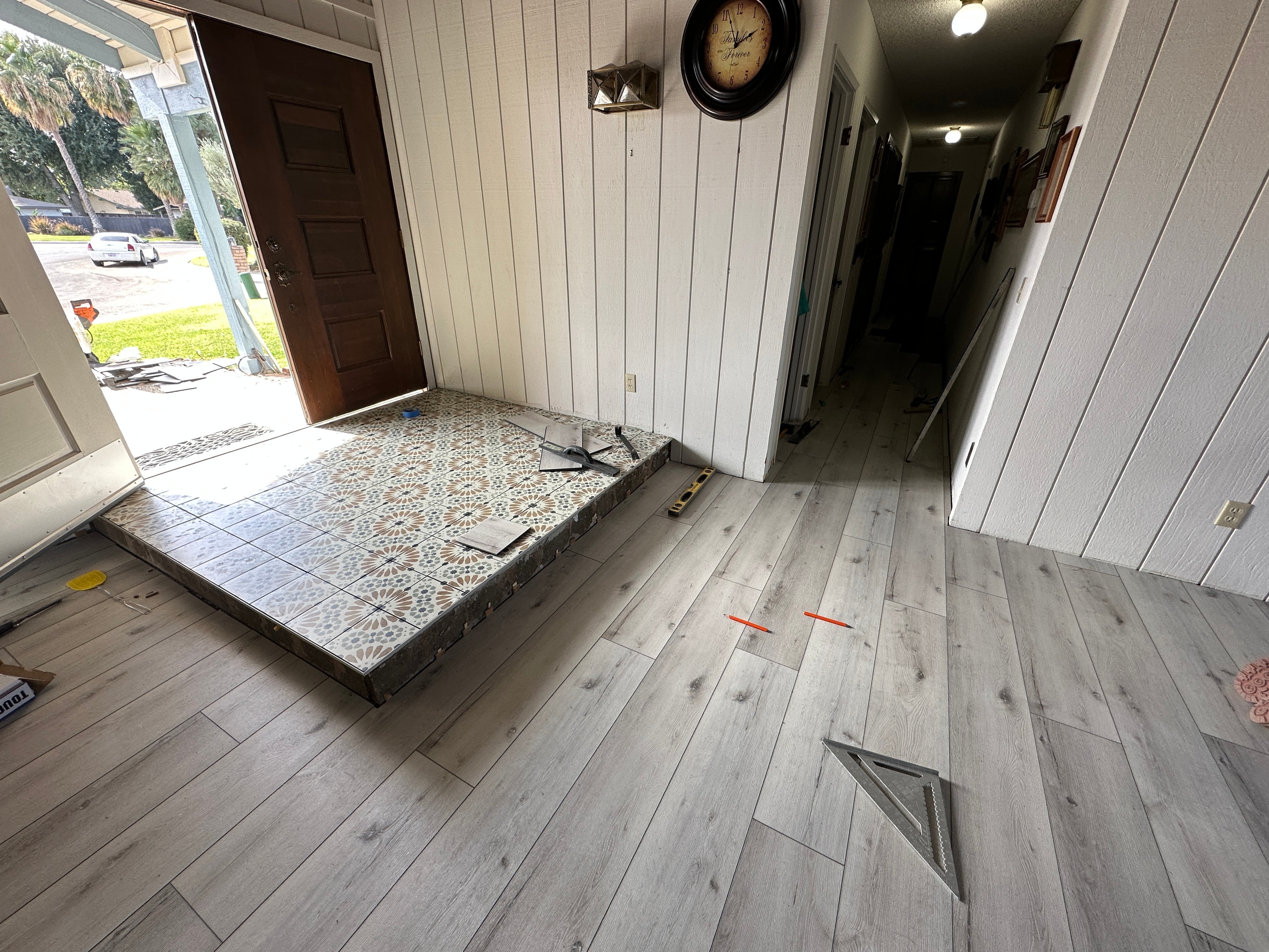 Home entryway under renovation flooring — HCIC